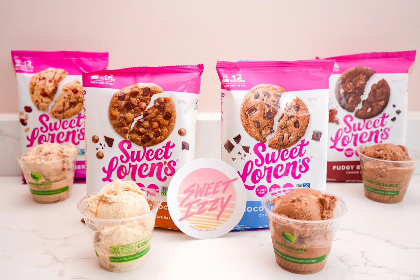 Pink cookie dough packages displayed with cups of ice cream
